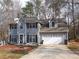 Charming two-story home featuring a two car garage and a well-maintained front yard at 3738 Windy Hill Se Dr, Conyers, GA 30013