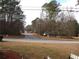 A serene view of the tree-lined street enhancing the property's curb appeal at 3738 Windy Hill Se Dr, Conyers, GA 30013