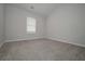 This spacious bedroom features a bright window, neutral paint and soft carpet at 455 Charleston Pl, Villa Rica, GA 30180