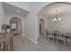 Spacious dining area with chandelier, wood floors, and archways to other living spaces at 455 Charleston Pl, Villa Rica, GA 30180