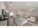 Open kitchen with stainless steel appliances, flowing into the living area for easy entertaining at 455 Charleston Pl, Villa Rica, GA 30180