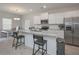 Spacious kitchen with granite island, bar stool seating, and stainless appliances creates a functional cooking space at 455 Charleston Pl, Villa Rica, GA 30180