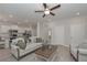 Bright living room adjoining kitchen, featuring modern appliances and a breakfast bar for casual dining at 455 Charleston Pl, Villa Rica, GA 30180