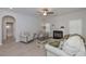 Cozy living room with plush seating, ceiling fan, and fireplace, creating a warm and inviting atmosphere at 455 Charleston Pl, Villa Rica, GA 30180