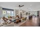 Bright and airy living room flowing into the kitchen, featuring hardwood floors and modern decor at 1121 Rivard Nw Cir, Atlanta, GA 30318