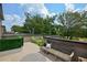 This outdoor rooftop deck provides seating and lovely treeline views at 1121 Rivard Nw Cir, Atlanta, GA 30318