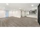 Inviting room with light gray flooring, light blue door and access to the kitchen at 2331 Luther St, Lithonia, GA 30058