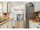 This kitchen has white cabinets and wooden countertops at 620 Bell Se Rd, Conyers, GA 30094