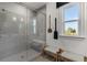 Modern bathroom featuring a frameless glass shower, neutral color palette, and bench seating at 1119 Rivard Nw Cir, Atlanta, GA 30318