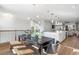 Open-concept dining room with modern chandelier adjacent to the kitchen and living room at 1119 Rivard Nw Cir, Atlanta, GA 30318