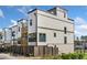 Modern two-story townhomes featuring white siding and a private balcony for outdoor enjoyment at 1119 Rivard Nw Cir, Atlanta, GA 30318