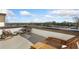 Roof deck featuring lounge seating and a scenic view of the surrounding community trees and construction at 1119 Rivard Nw Cir, Atlanta, GA 30318