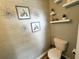 Half bathroom featuring decorative shelves and artwork at 139 Concord Place, Hiram, GA 30141