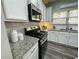 Close up of a modern kitchen with stainless steel appliances and granite countertops at 139 Concord Place, Hiram, GA 30141