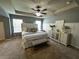 Comfortable main bedroom with a ceiling fan, carpet floors, decor and furniture at 139 Concord Place, Hiram, GA 30141