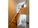 Staircase with carpet and wood railing at 139 Concord Place, Hiram, GA 30141