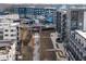 Aerial view highlighting modern apartments near a vibrant city park and bridge at 22 Airline Ne St # 403, Atlanta, GA 30312