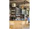 Indoor/outdoor view of a bar area with a bartender, liquor storage, and ample seating at the counter at 22 Airline Ne St # 403, Atlanta, GA 30312