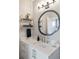 Stylish bathroom featuring a unique mirror, modern fixtures, and elegant shelving at 22 Airline Ne St # 403, Atlanta, GA 30312