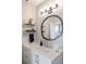 Bathroom boasting decorative mirror, quartz counter tops, white cabinets and modern fixtures at 22 Airline Ne St # 403, Atlanta, GA 30312