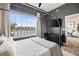 Comfortable bedroom with gray walls, a large window, and a TV for relaxing entertainment at 22 Airline Ne St # 403, Atlanta, GA 30312