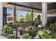 Inviting outdoor community area with lush plants, benches, tables, and a sculpture at 22 Airline Ne St # 403, Atlanta, GA 30312