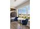 Cozy dining area featuring a small table, blue chairs, and a view of the neighborhood at 22 Airline Ne St # 403, Atlanta, GA 30312