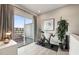 Bright exercise room with a Peloton bike, outdoor balcony, and a refreshing plant at 22 Airline Ne St # 403, Atlanta, GA 30312
