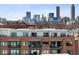 A stunning brick building with balconies overlooks the cityscape in a vibrant urban setting at 22 Airline Ne St # 403, Atlanta, GA 30312