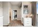 Hallway featuring hardwood floors, interior doors, and natural light from balcony access at 22 Airline Ne St # 403, Atlanta, GA 30312