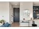 Open hallway with a console table, a round mirror, and doorway views into the other rooms at 22 Airline Ne St # 403, Atlanta, GA 30312