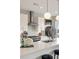 Close up of modern white kitchen with stainless steel appliances and a large island at 22 Airline Ne St # 403, Atlanta, GA 30312