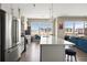 Modern kitchen features stainless steel appliances, white cabinets, quartz countertops, and an island with bar seating at 22 Airline Ne St # 403, Atlanta, GA 30312