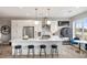 Modern kitchen featuring white cabinets, stainless steel appliances, a breakfast bar, and a dining area at 22 Airline Ne St # 403, Atlanta, GA 30312