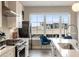 Modern white kitchen featuring a large island and stainless steel appliances at 22 Airline Ne St # 403, Atlanta, GA 30312