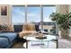 Well-decorated living room with plush seating, a glass coffee table, and a large window offering ample natural light at 22 Airline Ne St # 403, Atlanta, GA 30312