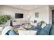 Comfortable living room showcases a blue sectional sofa, decorative furniture, and contemporary decor at 22 Airline Ne St # 403, Atlanta, GA 30312