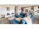 Open living room flows into the kitchen area, with a blue sectional sofa and plush decor at 22 Airline Ne St # 403, Atlanta, GA 30312