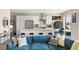 Open living space with a modern kitchen, dining area, and a comfortable living room with a large blue sofa at 22 Airline Ne St # 403, Atlanta, GA 30312
