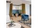 Comfortable lounge area with bench seating, armchairs, and modern decor, bathed in natural light at 22 Airline Ne St # 403, Atlanta, GA 30312