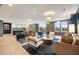 Spacious resident lounge features stylish seating, modern lighting, and an open kitchen with breakfast bar at 22 Airline Ne St # 403, Atlanta, GA 30312