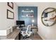 This office features custom built-in shelving, blue accent wall, and modern décor elements at 22 Airline Ne St # 403, Atlanta, GA 30312