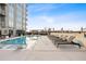 Modern rooftop pool with city skyline views, surrounded by lounge chairs and lush greenery, offering a luxurious retreat at 22 Airline Ne St # 403, Atlanta, GA 30312