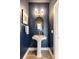 Stylish powder room features elegant fixtures, modern lighting, and a sleek pedestal sink at 22 Airline Ne St # 403, Atlanta, GA 30312