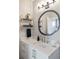 Chic bathroom featuring a decorative mirror, floating shelves, and elegant fixtures at 22 Airline Ne St # 403, Atlanta, GA 30312