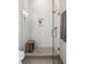 Modern bathroom showcasing a glass-enclosed shower with white subway tile and a wooden bench at 22 Airline Ne St # 403, Atlanta, GA 30312