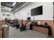 Modern gym with cardio machines, weights, and a large screen TV at 22 Airline Ne St # 403, Atlanta, GA 30312