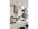 Close-up of a modern kitchen with stainless steel appliances, white cabinets, and a sleek island countertop at 22 Airline Street Ne # 403, Atlanta, GA 30312