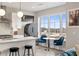 Well-lit kitchen featuring a breakfast bar, stainless steel appliances, and a view through large windows at 22 Airline Ne St # 403, Atlanta, GA 30312