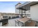 Rooftop deck featuring a dining area, offering an ideal space for outdoor gatherings and relaxation at 22 Airline Street Ne # 403, Atlanta, GA 30312